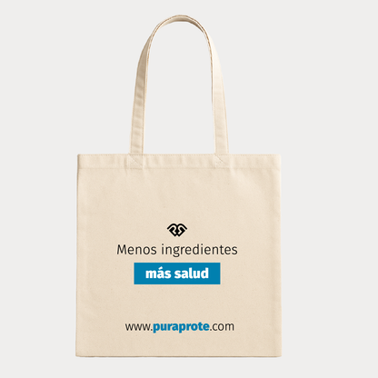 vista frontal de tote bag pura prote donde se ve el icono pura prote y la frase menos ingredientes más salud